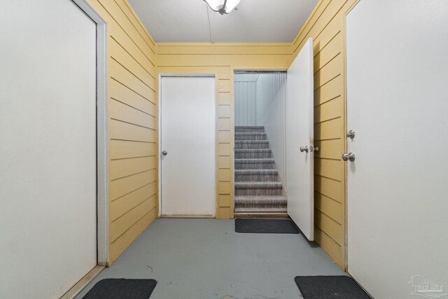 interior space featuring wood walls