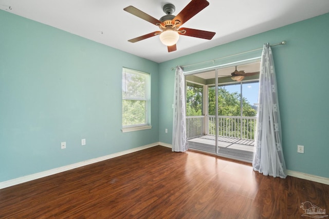 unfurnished room featuring dark wood-type flooring and ceiling fan