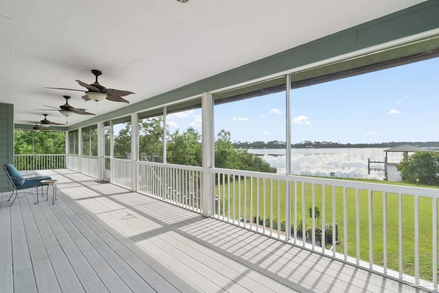 deck with a yard and ceiling fan