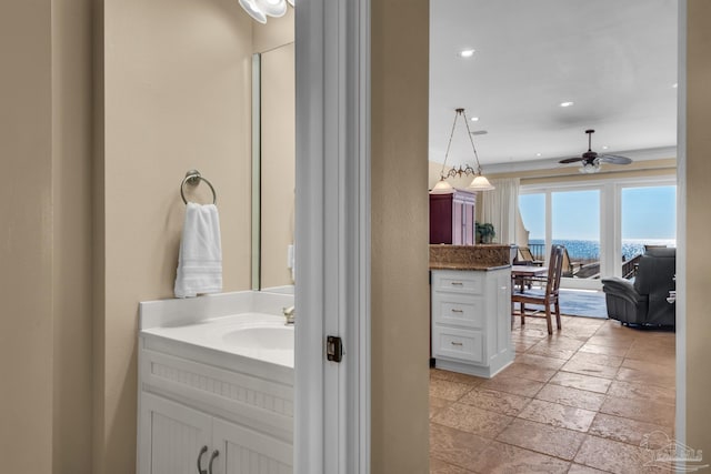 bathroom featuring vanity, tile patterned floors, and ceiling fan