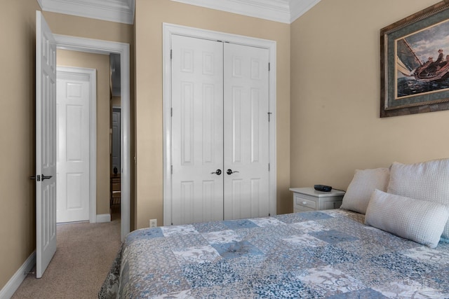 carpeted bedroom with a closet and ornamental molding