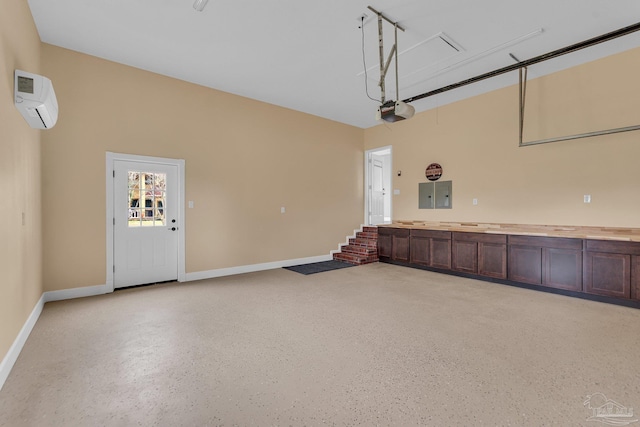 garage with a wall mounted air conditioner, a garage door opener, and electric panel