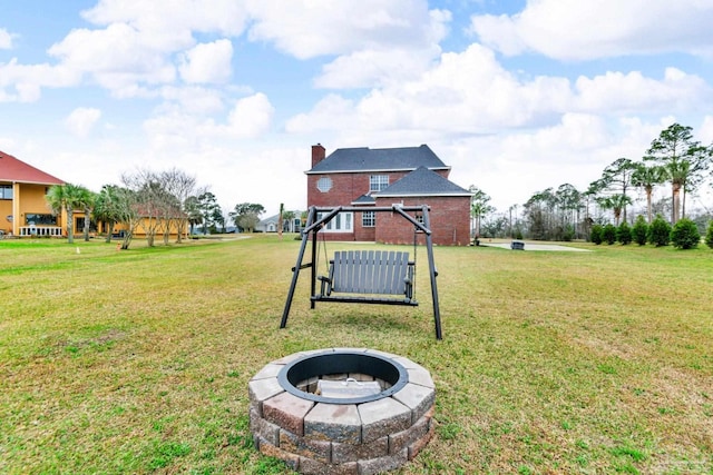 view of yard with a gazebo and a fire pit