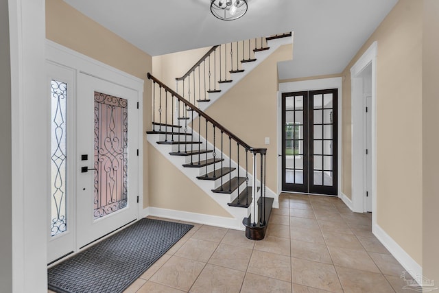 tiled foyer entrance with french doors