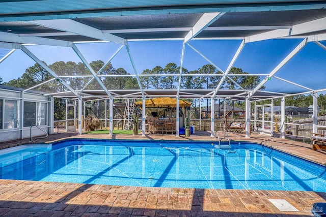 pool with a lanai and a patio