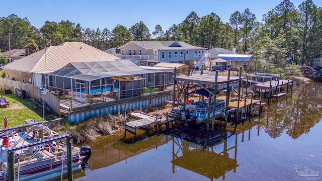 view of dock featuring a water view, glass enclosure, boat lift, and an outdoor pool