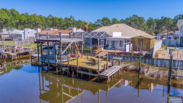 dock area featuring a water view and fence