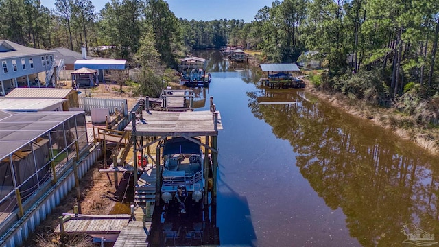 dock area with a water view and boat lift