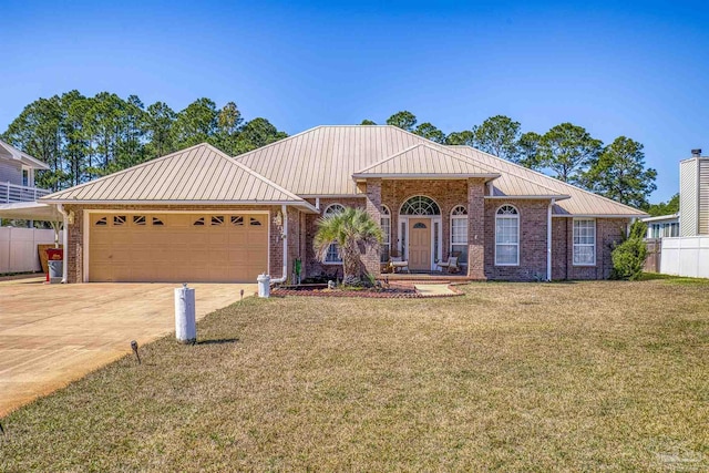 ranch-style home with a garage, a standing seam roof, concrete driveway, and brick siding