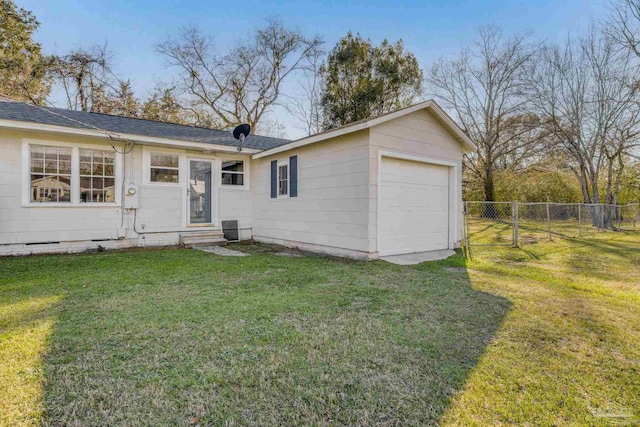 view of front of home with an attached garage, a front yard, crawl space, fence, and driveway