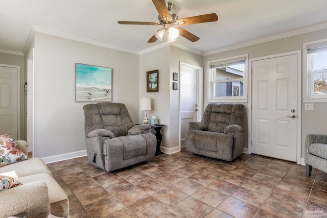 living room featuring baseboards, a ceiling fan, and crown molding