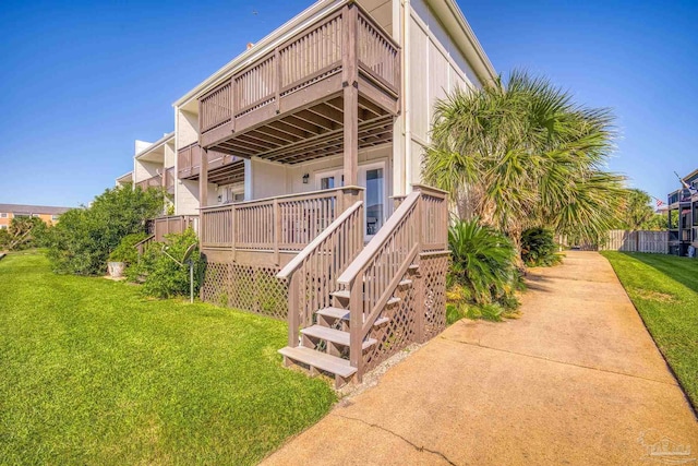 view of home's exterior with a lawn and a wooden deck