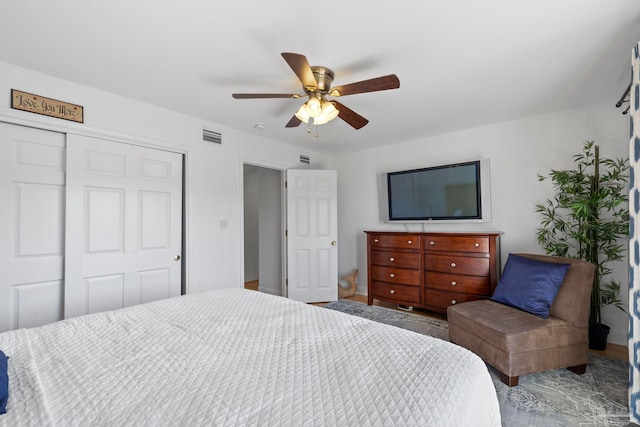 bedroom featuring ceiling fan and a closet