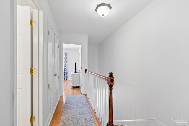 hall with light hardwood / wood-style floors