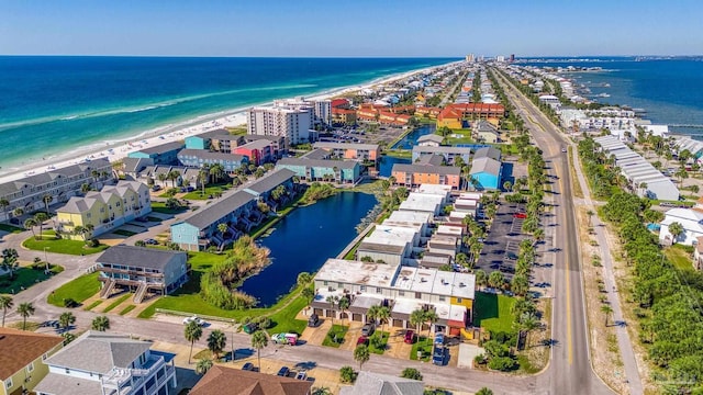 aerial view with a water view and a view of the beach