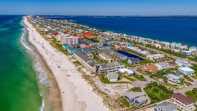 bird's eye view featuring a view of the beach and a water view