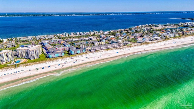 birds eye view of property featuring a water view and a view of the beach