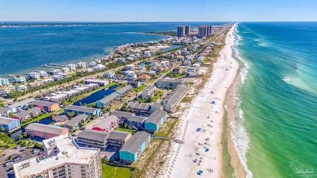 aerial view with a water view and a view of the beach