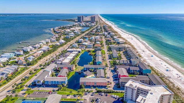 aerial view with a water view and a beach view