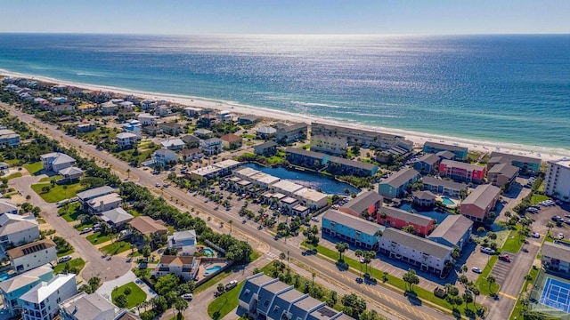 drone / aerial view with a water view and a view of the beach