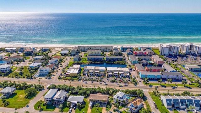 birds eye view of property with a view of the beach and a water view