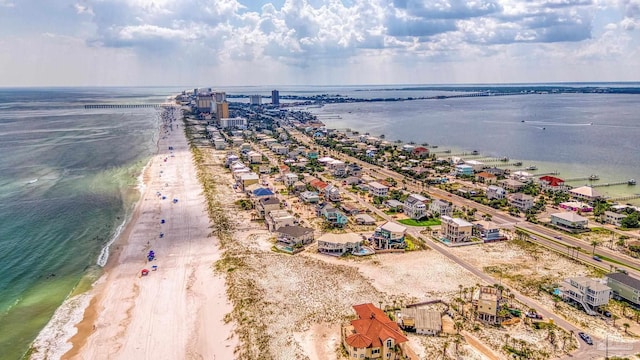 bird's eye view featuring a beach view and a water view