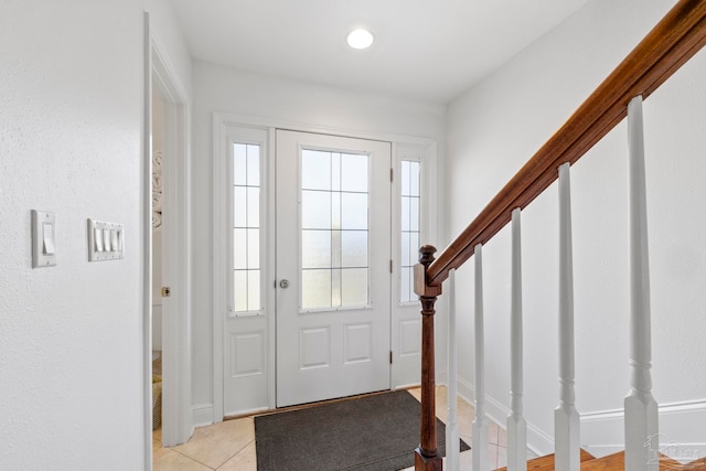 entrance foyer featuring light tile patterned floors