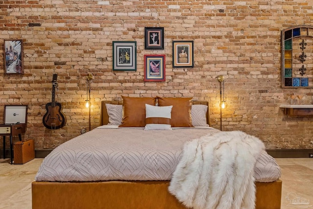 bedroom with brick wall