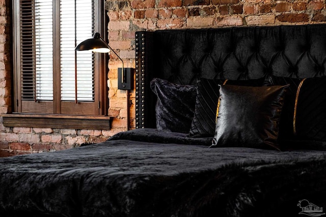 bedroom with brick wall