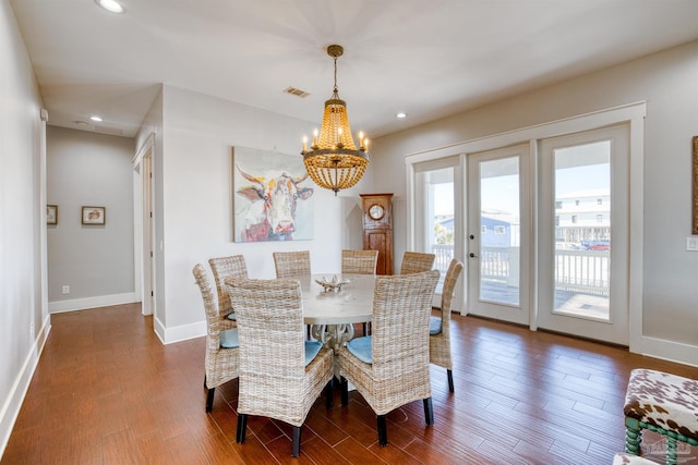 712 Maldonado Dr, Pensacola Beach, FL 32561 - dining area featuring wood finished floors, baseboards, visible vents, recessed lighting, and a chandelier