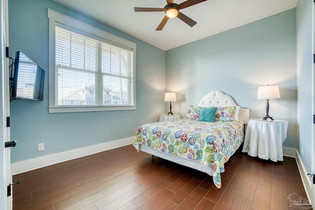 712 Maldonado Dr, Pensacola Beach, FL 32561 - bedroom with wood finished floors, baseboards, and ceiling fan