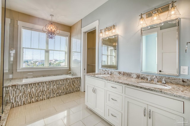 712 Maldonado Dr, Pensacola Beach, FL 32561 - bathroom featuring a sink, a notable chandelier, double vanity, and tile patterned floors
