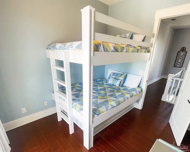 712 Maldonado Dr, Pensacola Beach, FL 32561 - bedroom featuring baseboards and wood finished floors