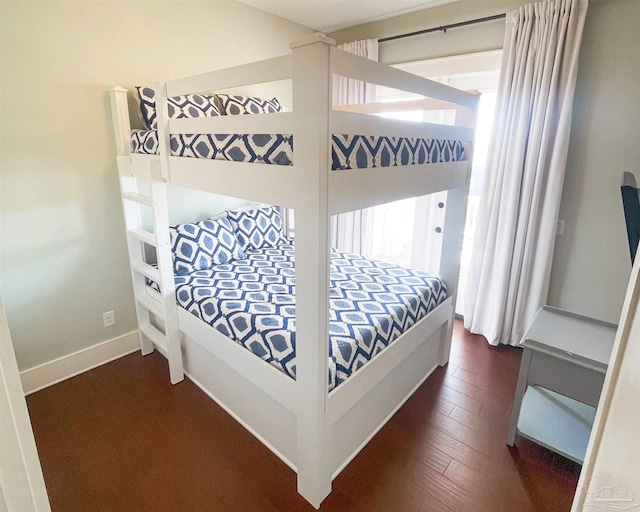 712 Maldonado Dr, Pensacola Beach, FL 32561 - bedroom featuring dark wood-type flooring and baseboards