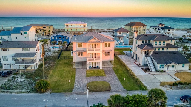 712 Maldonado Dr, Pensacola Beach, FL 32561 - aerial view at dusk featuring a residential view and a water view