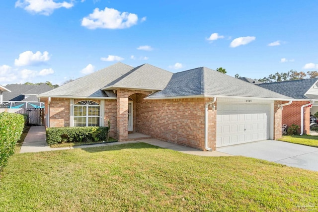 ranch-style home featuring a garage and a front lawn