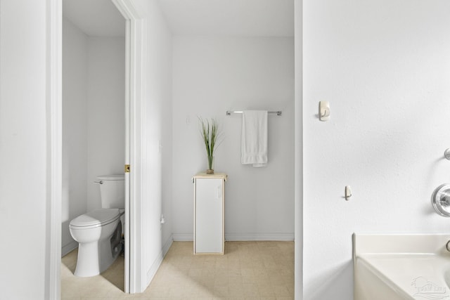 bathroom with a bathtub and toilet