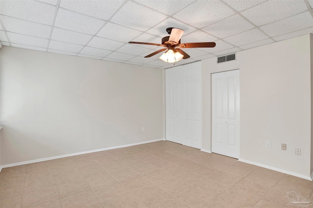 unfurnished bedroom featuring a paneled ceiling and ceiling fan