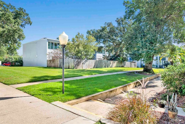 view of home's community featuring a yard