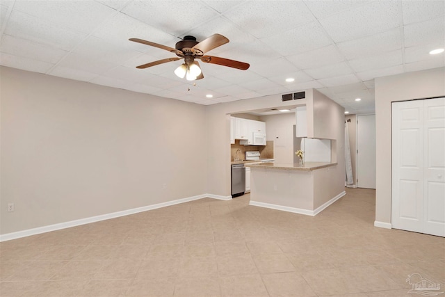 unfurnished living room featuring light tile patterned floors and ceiling fan