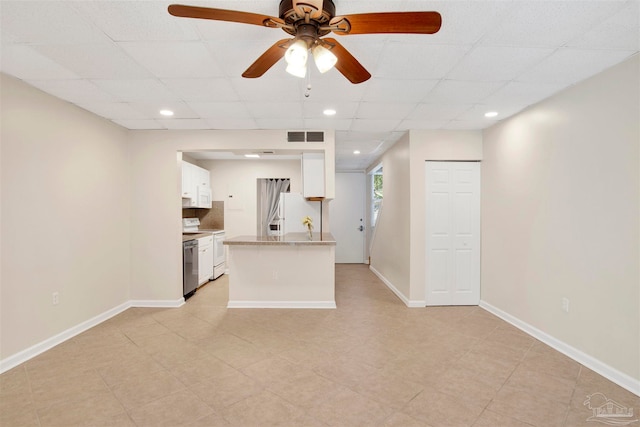 unfurnished living room with ceiling fan and light tile patterned floors