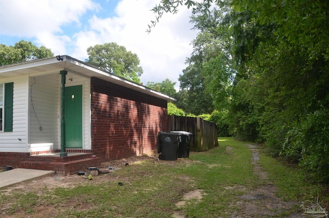 3031 Kingsfield Rd, Pensacola, FL 32514 - view of side of home with fence and brick siding