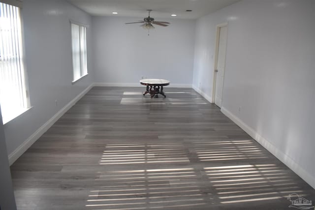 spare room featuring baseboards, a ceiling fan, wood finished floors, and recessed lighting