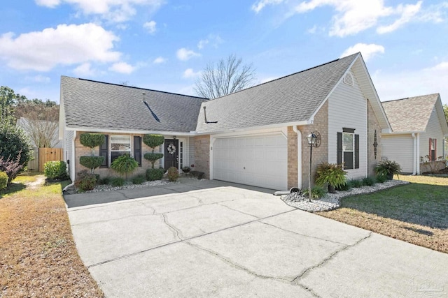 view of front of house with a front yard and a garage