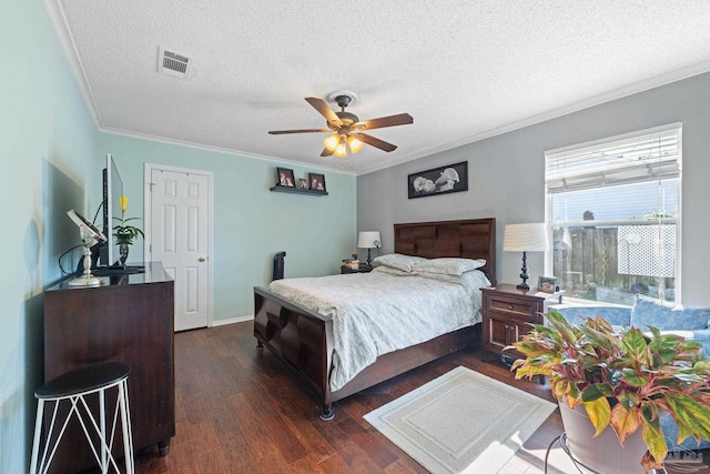 bedroom featuring a textured ceiling, ceiling fan, ornamental molding, and dark hardwood / wood-style floors