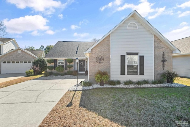 view of front of property featuring a garage and a front yard