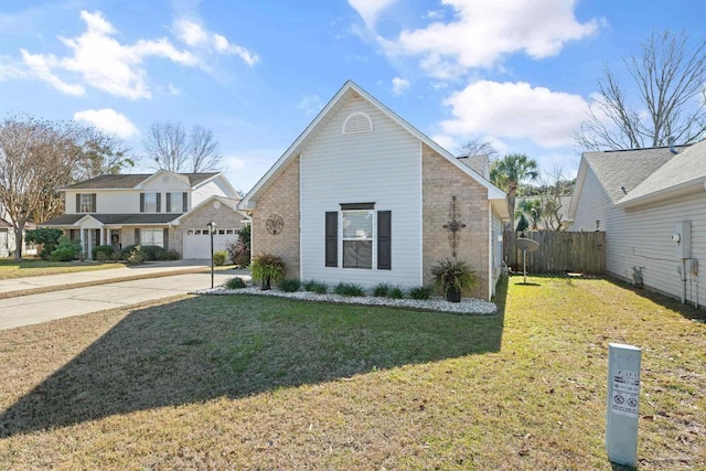 view of front of house featuring a front lawn and a garage