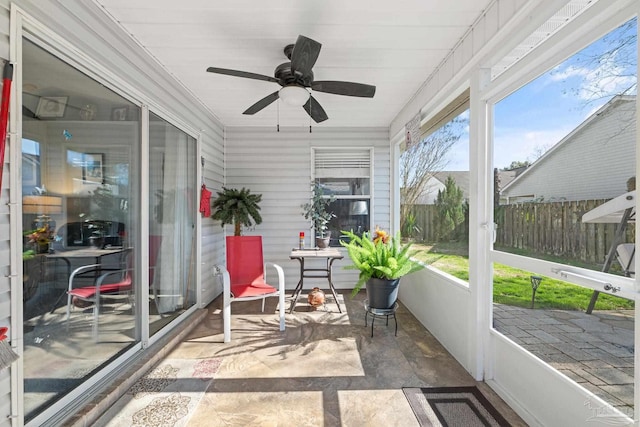 sunroom / solarium with ceiling fan and a wealth of natural light