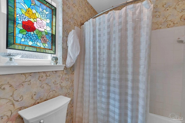 bathroom with toilet and shower / tub combo with curtain