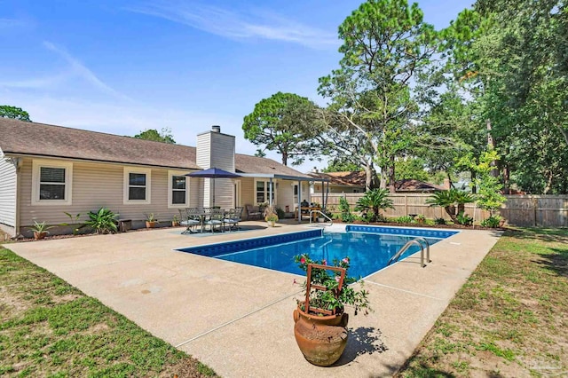 view of swimming pool featuring a patio area